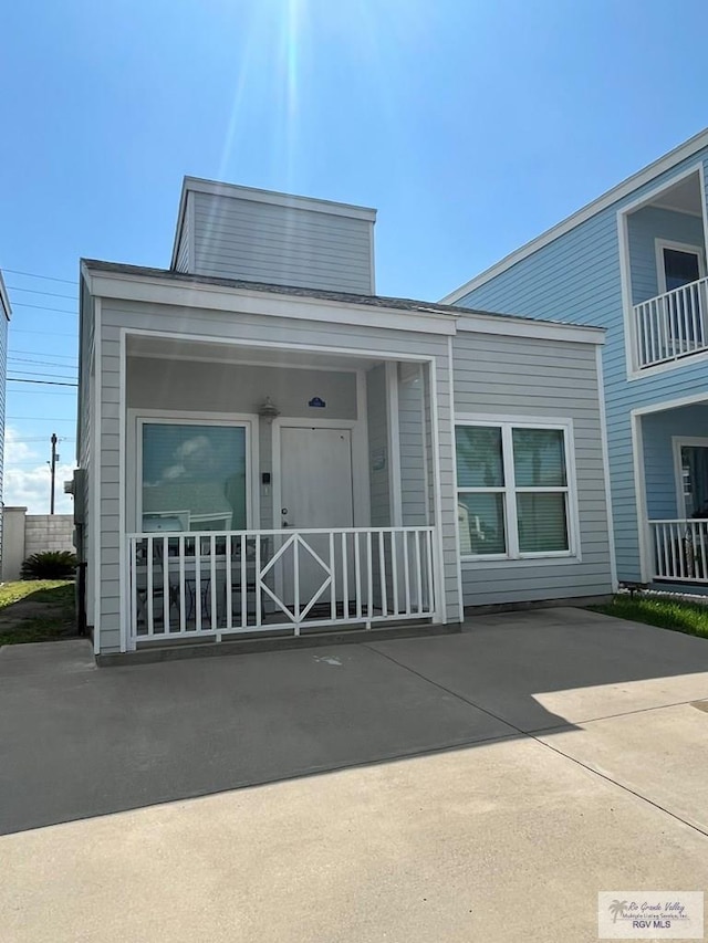 doorway to property featuring a porch