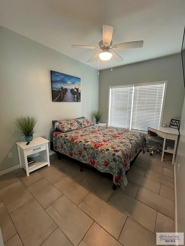 tiled bedroom with ceiling fan