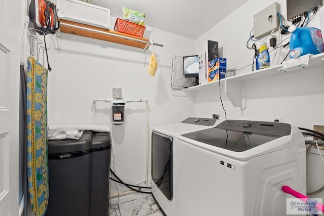 laundry room featuring washer and clothes dryer