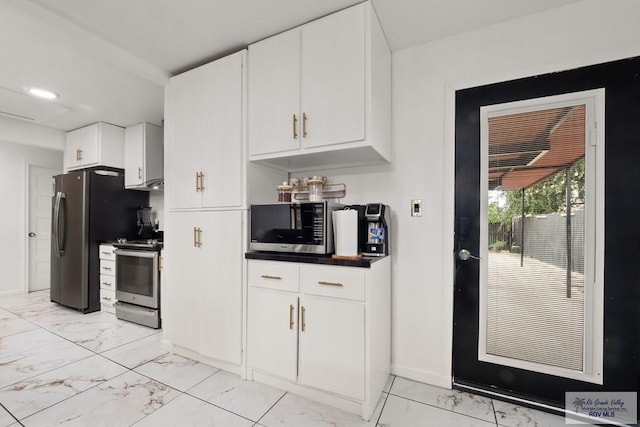 kitchen featuring white cabinetry and appliances with stainless steel finishes