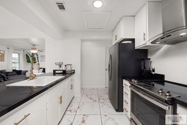 kitchen featuring white cabinetry, stainless steel electric stove, wall chimney exhaust hood, and ceiling fan