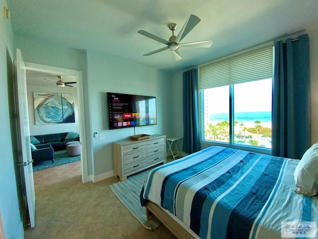 tiled bedroom with ceiling fan