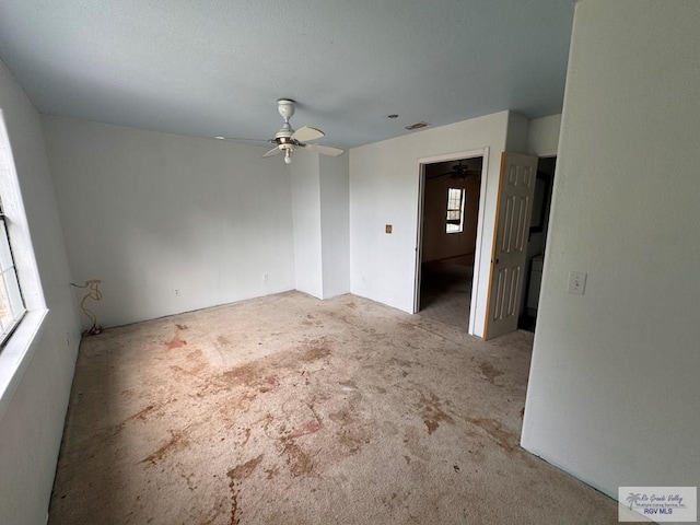 spare room with light carpet