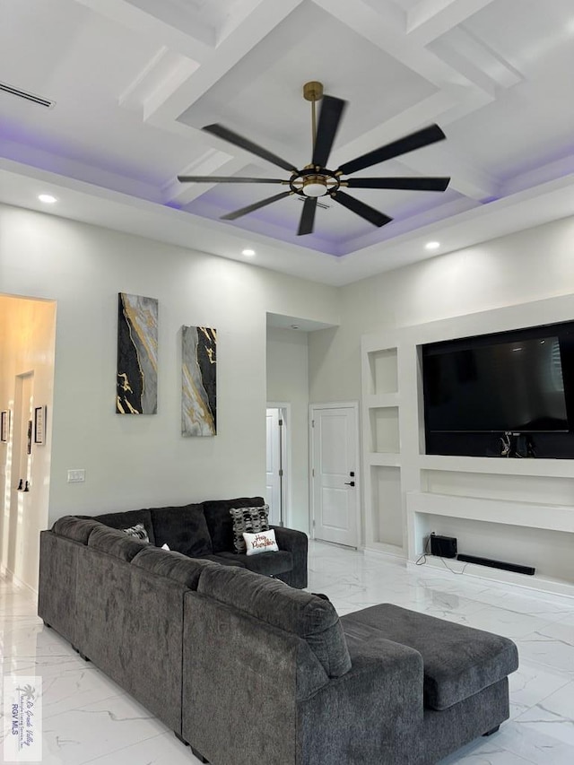 living room with built in features and ceiling fan