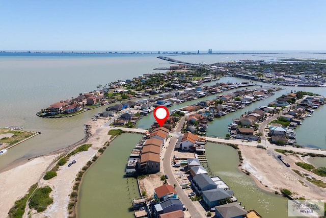 1302 Harbor Island Dr, Port Isabel, TX 78526 - aerial view of property's location featuring a large body of water and nearby suburban area
