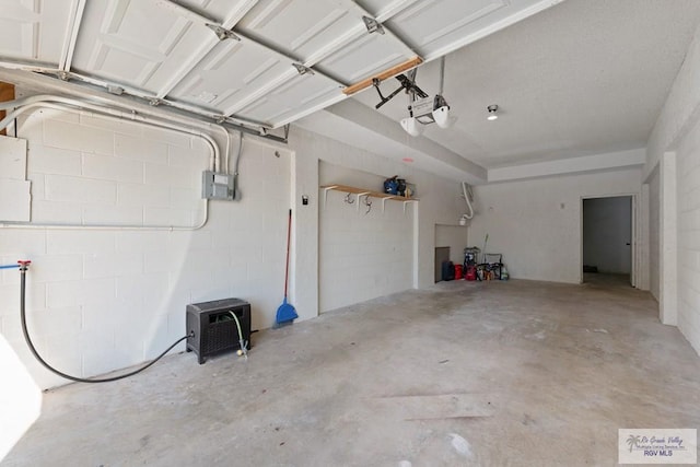 1302 Harbor Island Dr, Port Isabel, TX 78526 - garage with a garage door opener and concrete block wall