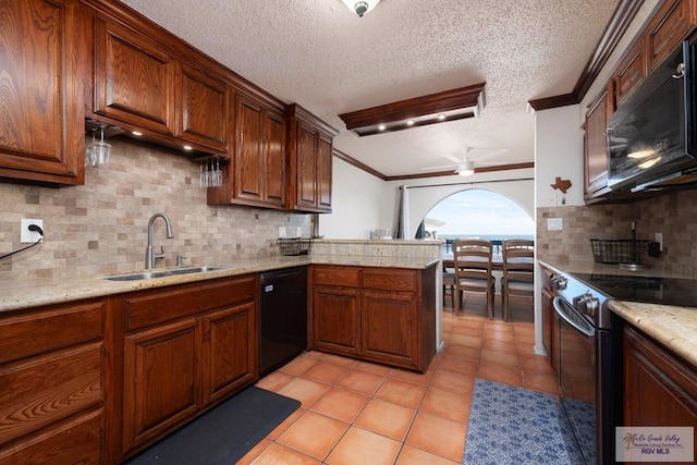 1302 Harbor Island Dr, Port Isabel, TX 78526 - kitchen with black appliances, ornamental molding, a peninsula, backsplash, and ceiling fan