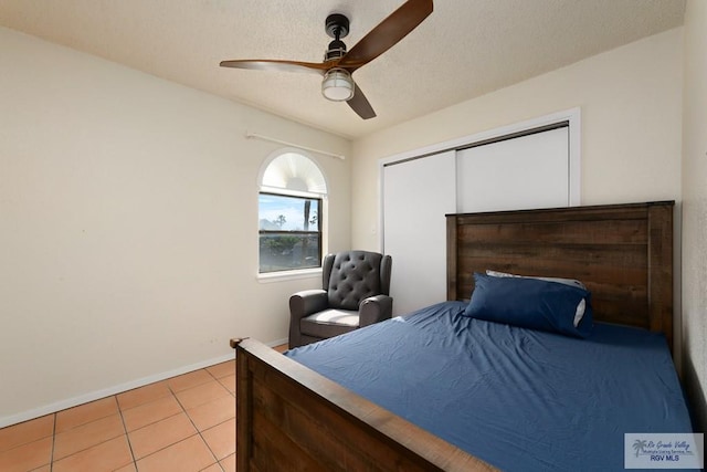 1302 Harbor Island Dr, Port Isabel, TX 78526 - bedroom with tile patterned flooring, a closet, and ceiling fan