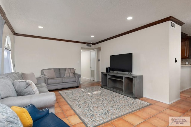 1302 Harbor Island Dr, Port Isabel, TX 78526 - living area with ornamental molding, light tile patterned floors, a textured ceiling, and recessed lighting