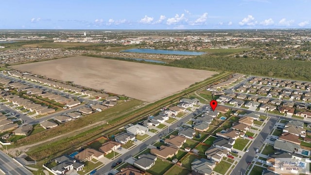 aerial view featuring a residential view and a water view