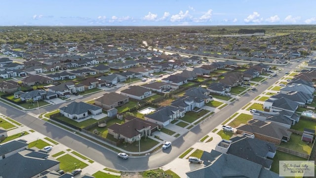 birds eye view of property with a residential view