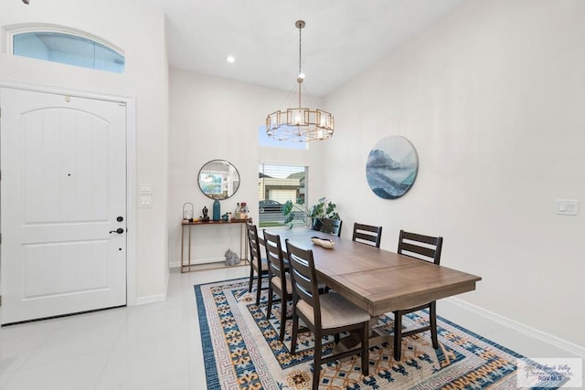 dining space with light tile patterned floors, recessed lighting, baseboards, and a chandelier