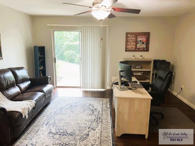 office area with ceiling fan and hardwood / wood-style flooring