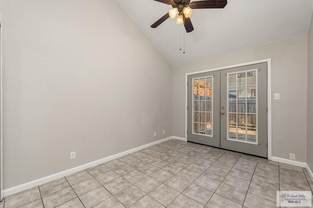 tiled spare room with ceiling fan, french doors, and vaulted ceiling