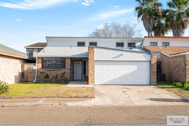 view of front facade with a garage and a front yard