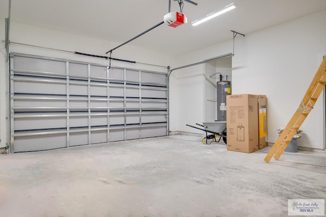 garage with a garage door opener and water heater