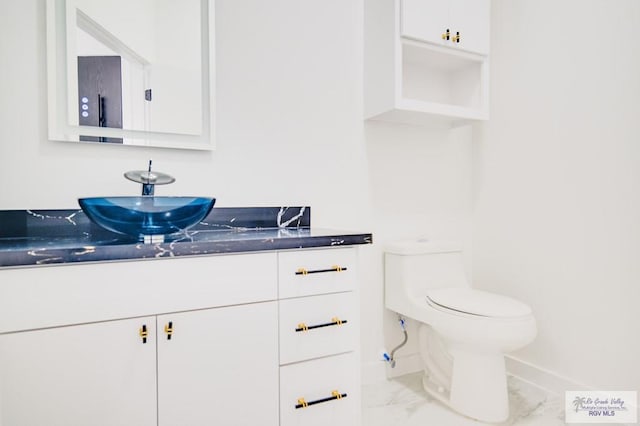 bathroom with vanity and toilet