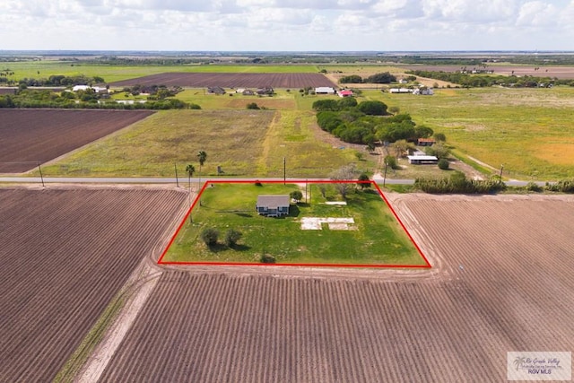 birds eye view of property with a rural view