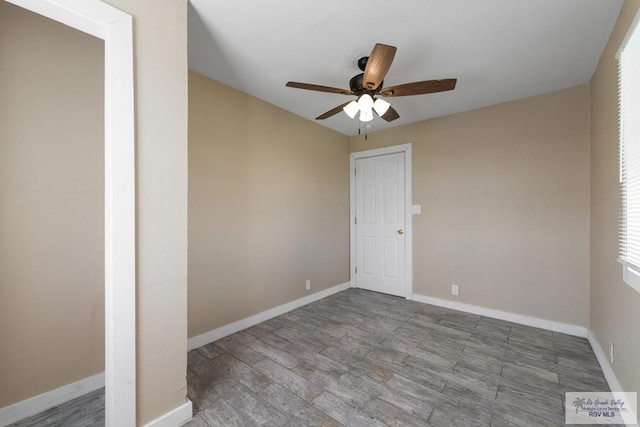 empty room featuring ceiling fan and light hardwood / wood-style floors