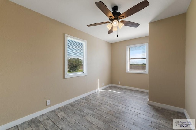 empty room with light hardwood / wood-style floors and ceiling fan