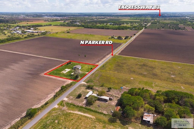 birds eye view of property featuring a rural view