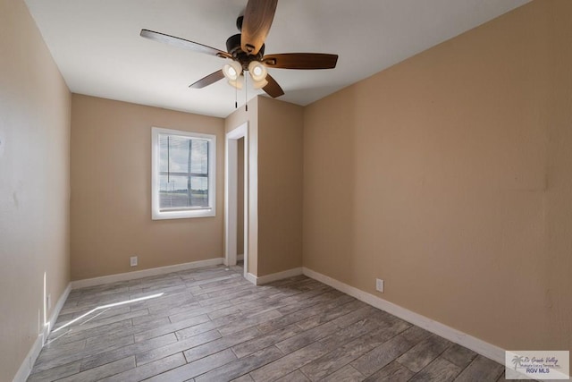 unfurnished room featuring light wood-type flooring and ceiling fan