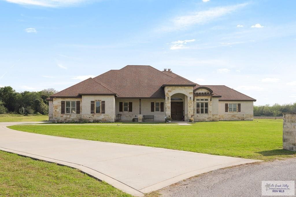 view of front of property with a front lawn