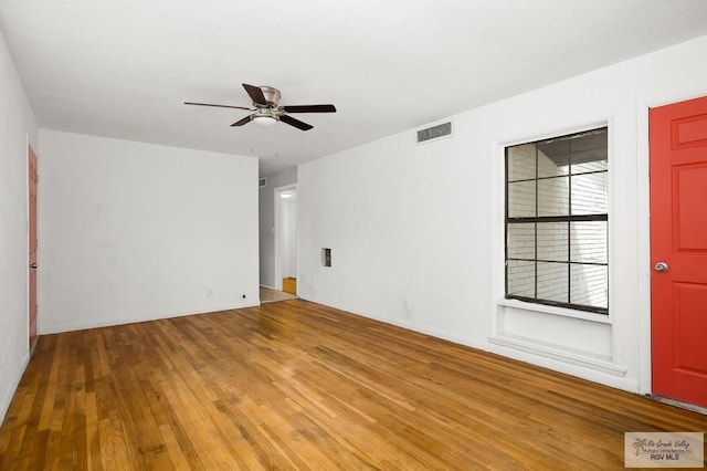 empty room featuring ceiling fan and light wood-type flooring