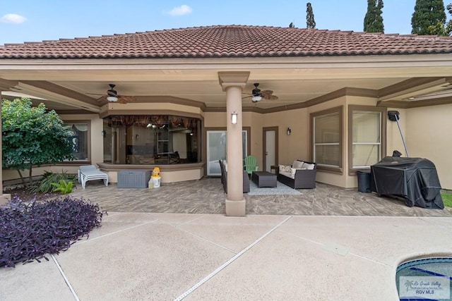 view of patio / terrace with area for grilling, ceiling fan, and an outdoor hangout area