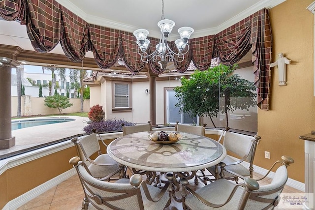 sunroom with an inviting chandelier