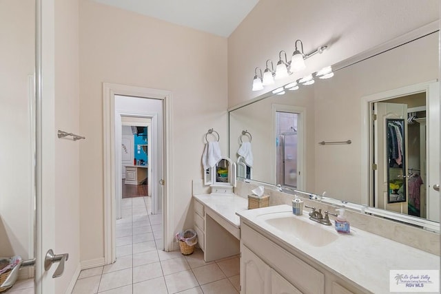 bathroom featuring tile patterned flooring and vanity