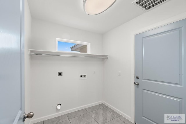 laundry room with hookup for an electric dryer, light tile patterned floors, and washer hookup