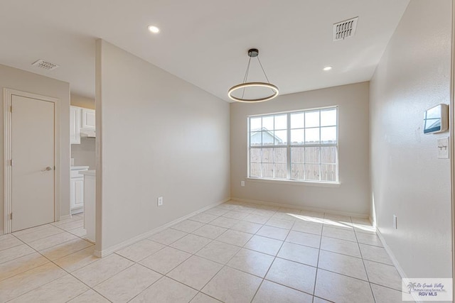 2400 Firenze St, Brownsville, TX 78520 - empty room with light tile patterned flooring and recessed lighting