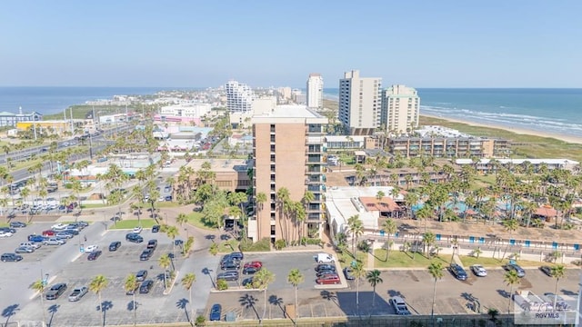 birds eye view of property featuring a water view and a view of the beach