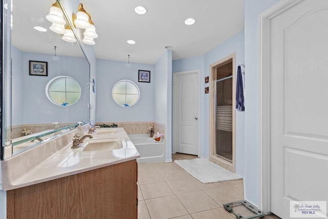 1730 Christian Cir, Harlingen, TX 78550 - bathroom with tile patterned flooring, double vanity, a garden tub, a shower stall, and recessed lighting