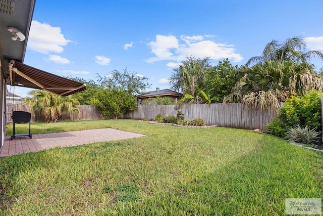 1730 Christian Cir, Harlingen, TX 78550 - fenced backyard featuring a patio area