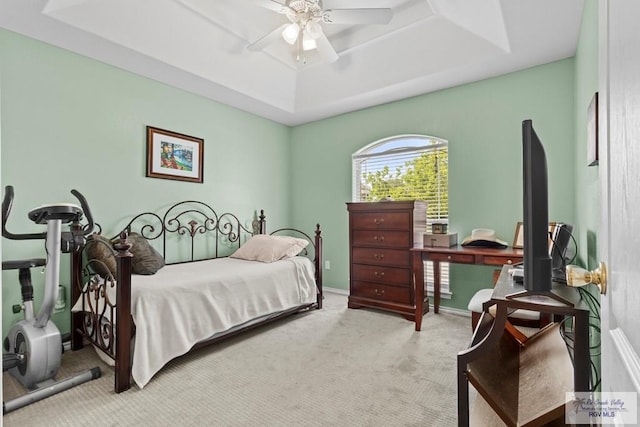 1730 Christian Cir, Harlingen, TX 78550 - bedroom featuring a raised ceiling, light carpet, and a ceiling fan