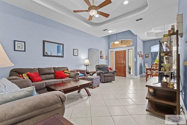 1730 Christian Cir, Harlingen, TX 78550 - living area with arched walkways, a raised ceiling, light tile patterned floors, a ceiling fan, and recessed lighting
