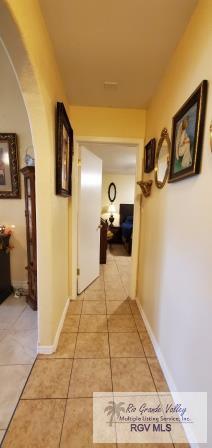 hall with light tile patterned flooring