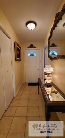 doorway to outside featuring light tile patterned floors