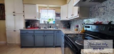 kitchen featuring white cabinetry, light tile patterned flooring, black range with electric stovetop, and extractor fan