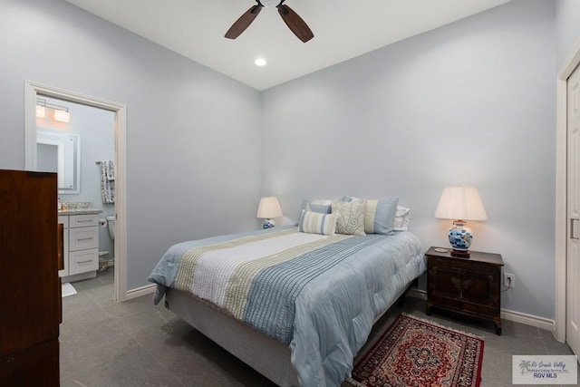 bedroom with ceiling fan, recessed lighting, ensuite bath, and baseboards