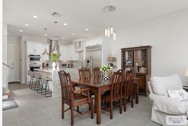 dining space featuring light tile patterned floors, a toaster, visible vents, and recessed lighting