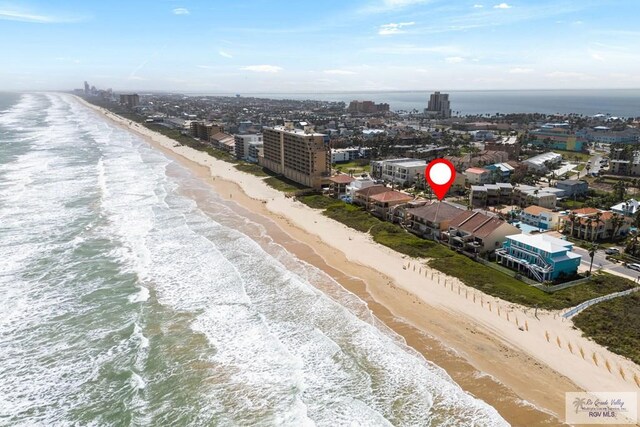 birds eye view of property featuring a city view, a beach view, and a water view