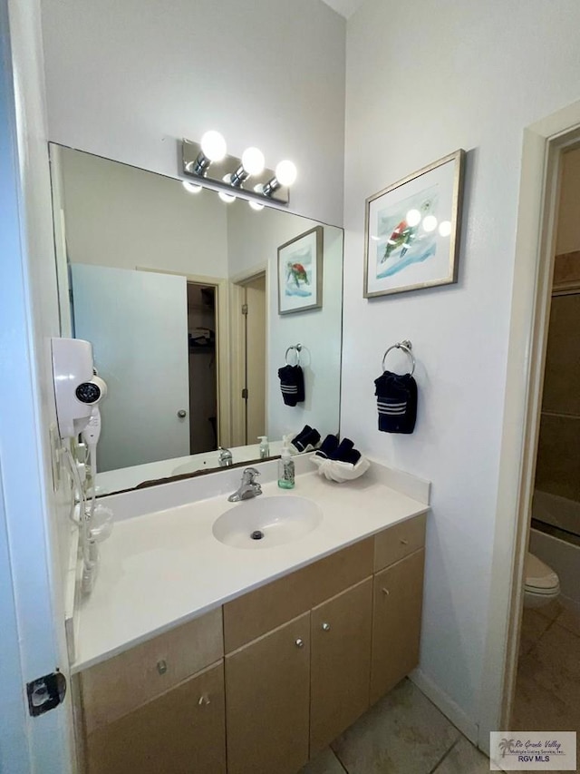 full bath featuring tile patterned flooring, toilet, and vanity