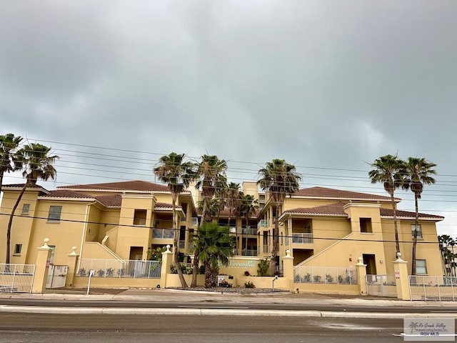 view of property with fence