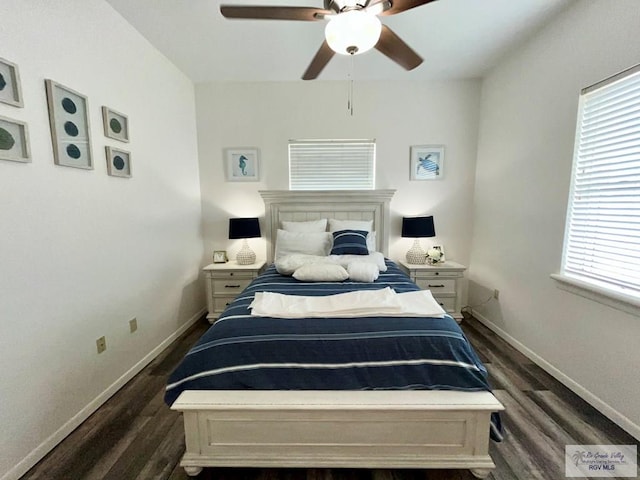 bedroom featuring baseboards, a ceiling fan, and dark wood-style floors