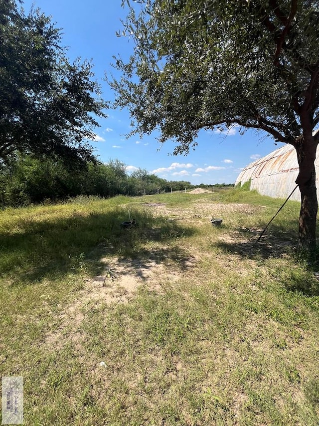 view of yard with a rural view