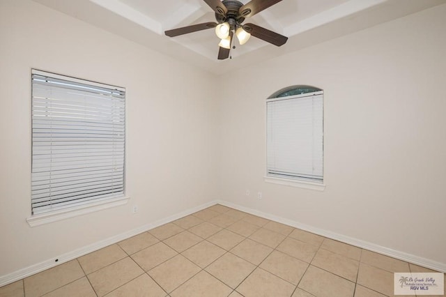 1508 W 20th St, Mission, TX 78572 - empty room with ceiling fan, light tile patterned flooring, a tray ceiling, and baseboards
