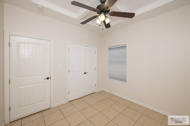 1508 W 20th St, Mission, TX 78572 - unfurnished bedroom with light tile patterned floors, a closet, ceiling fan, and baseboards